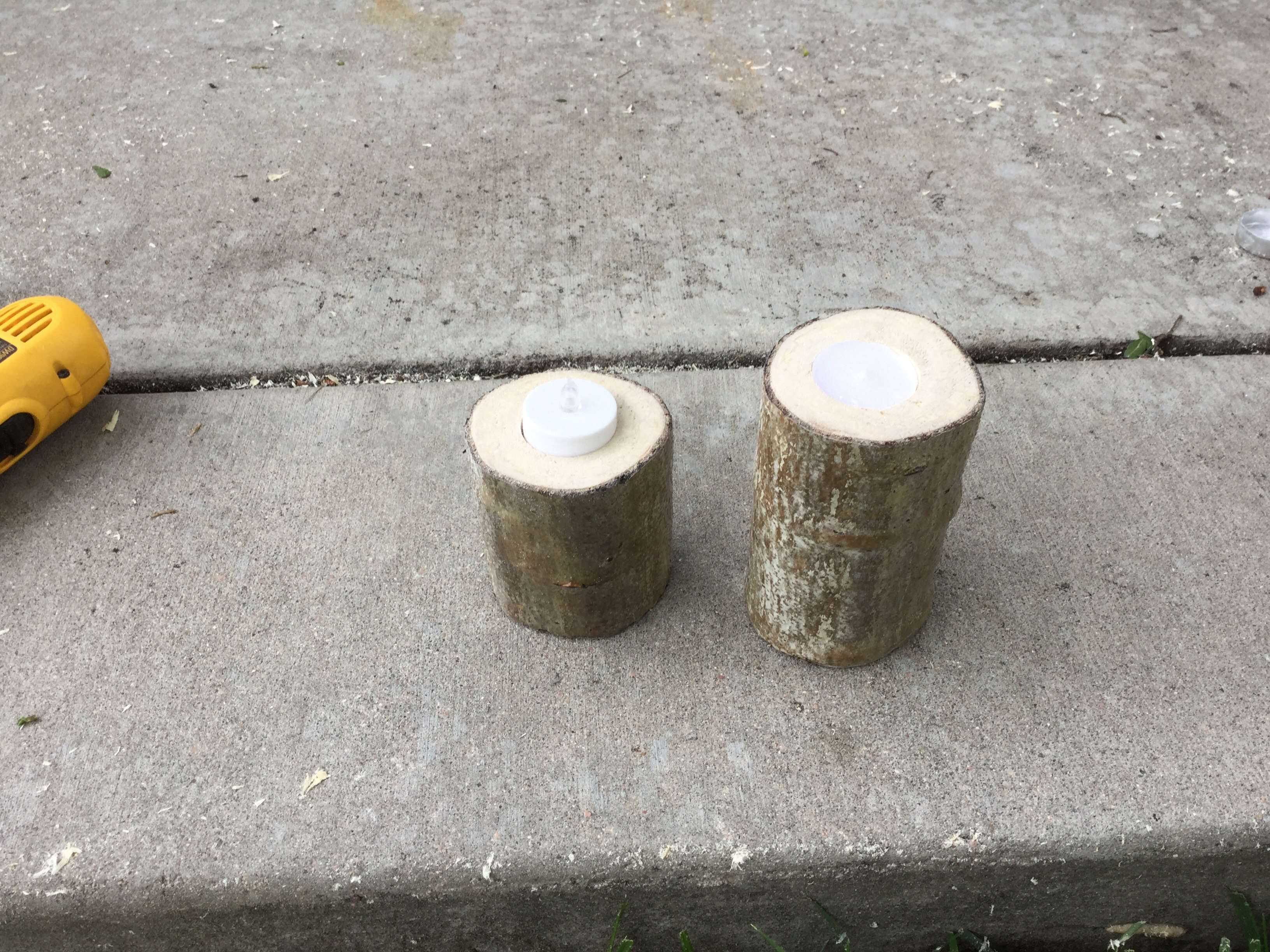 We could have drilled the battery-operated tealight down more but then the candle tealight would have sat down too low and we didn't want the flame that blows in the wood.