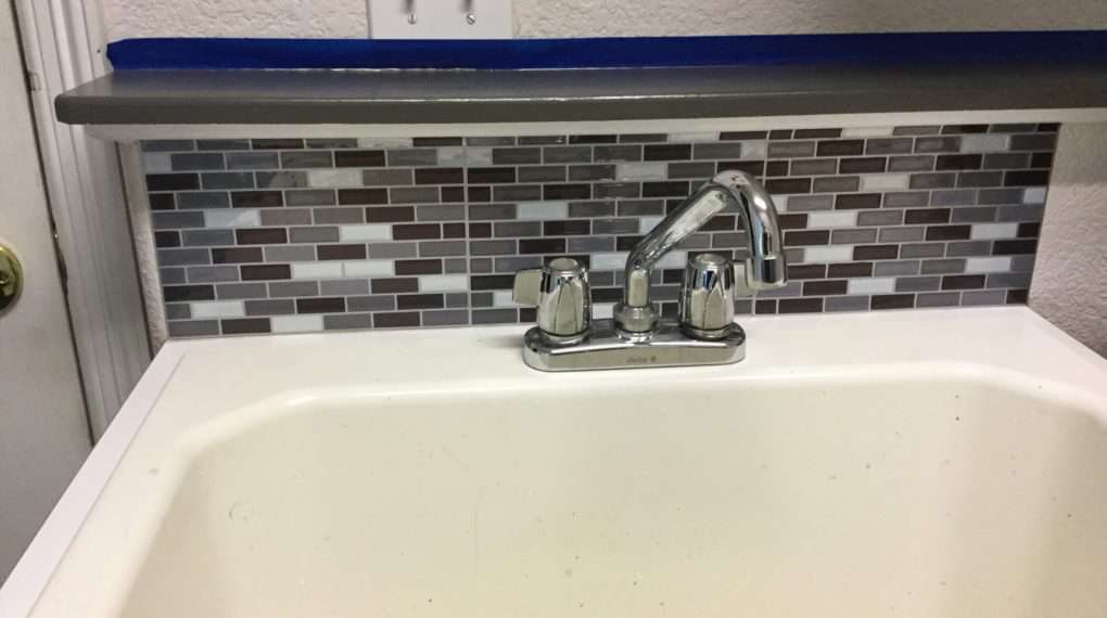 I added a peel and stick back splash to the laundry sink as well.