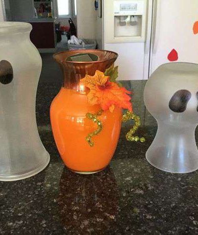 Do you have a bunch of vases on hand? Try these couple repurposed ideas - ghost & pumpkin vases