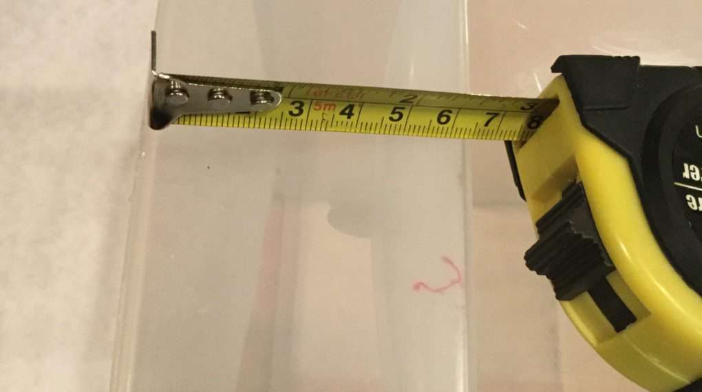 I measured the top down to the handle, and it was about 2 1/2". The indent portion of the bottom half of the drawer would take more contact paper than the upper portion. I needed to cut my pattern in 1/2 to accommodate this.
