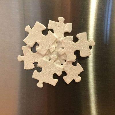 Do you have a puzzle laying around that isn't being used or perhaps it's missing pieces? I have a great project that turns puzzle pieces into a magnetic snowflake! It's super easy, kids can get in on the fun as well. Great for gift ideas, craft night, classroom parties, etc.