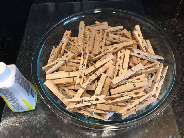 Put your clothes pins in a large bowl or bucket. *For my wreath it is a 14" frame from Dollar Tree and it took 156 clothespins.