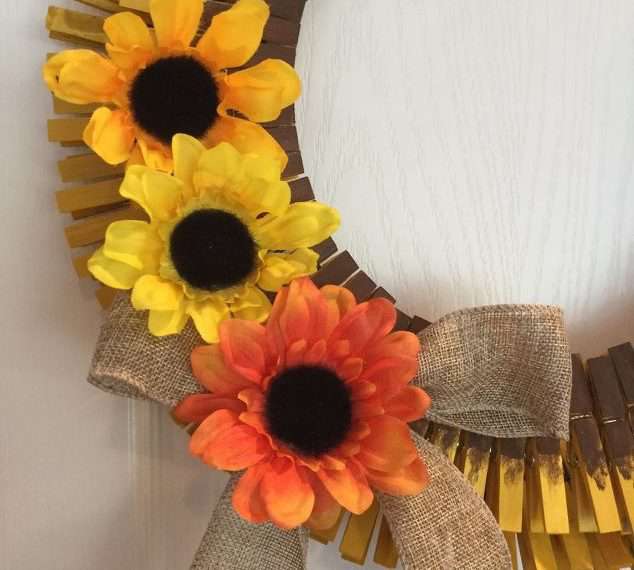 Add a burlap ribbon bow, and pull some sunflower heads off a bouquet and hot glue them onto your wreath.