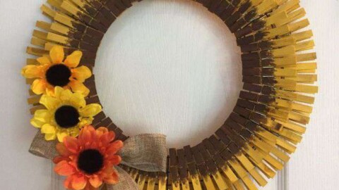 Tie a piece of twine at the top for hanging. Your clothespin sunflower wreath is done for you to enjoy.