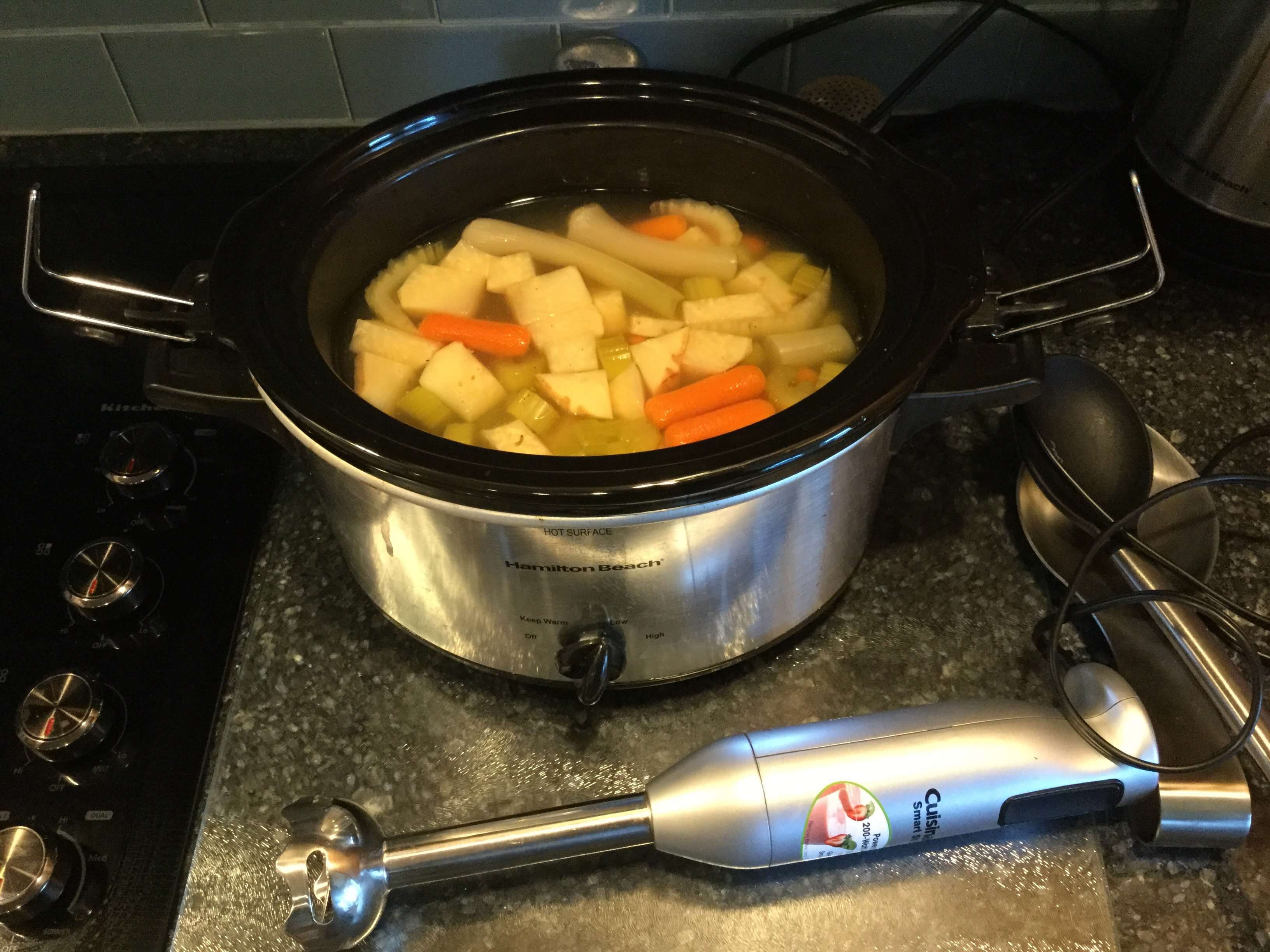 When the veggies are tender - use your wand blender or regular blender to puree the veggies into the soup.