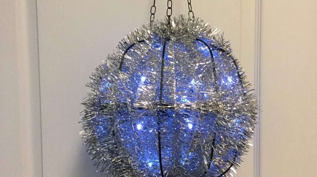 Add one of the flower hanging basket planter chains to the top so you can hang it.