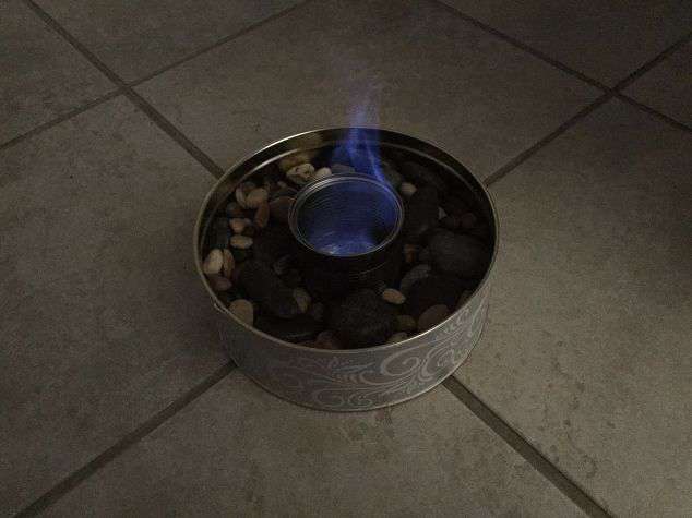 To put the fire out - simply save the can lid to snuff it, or you can lay a damp washcloth or towel over it.
