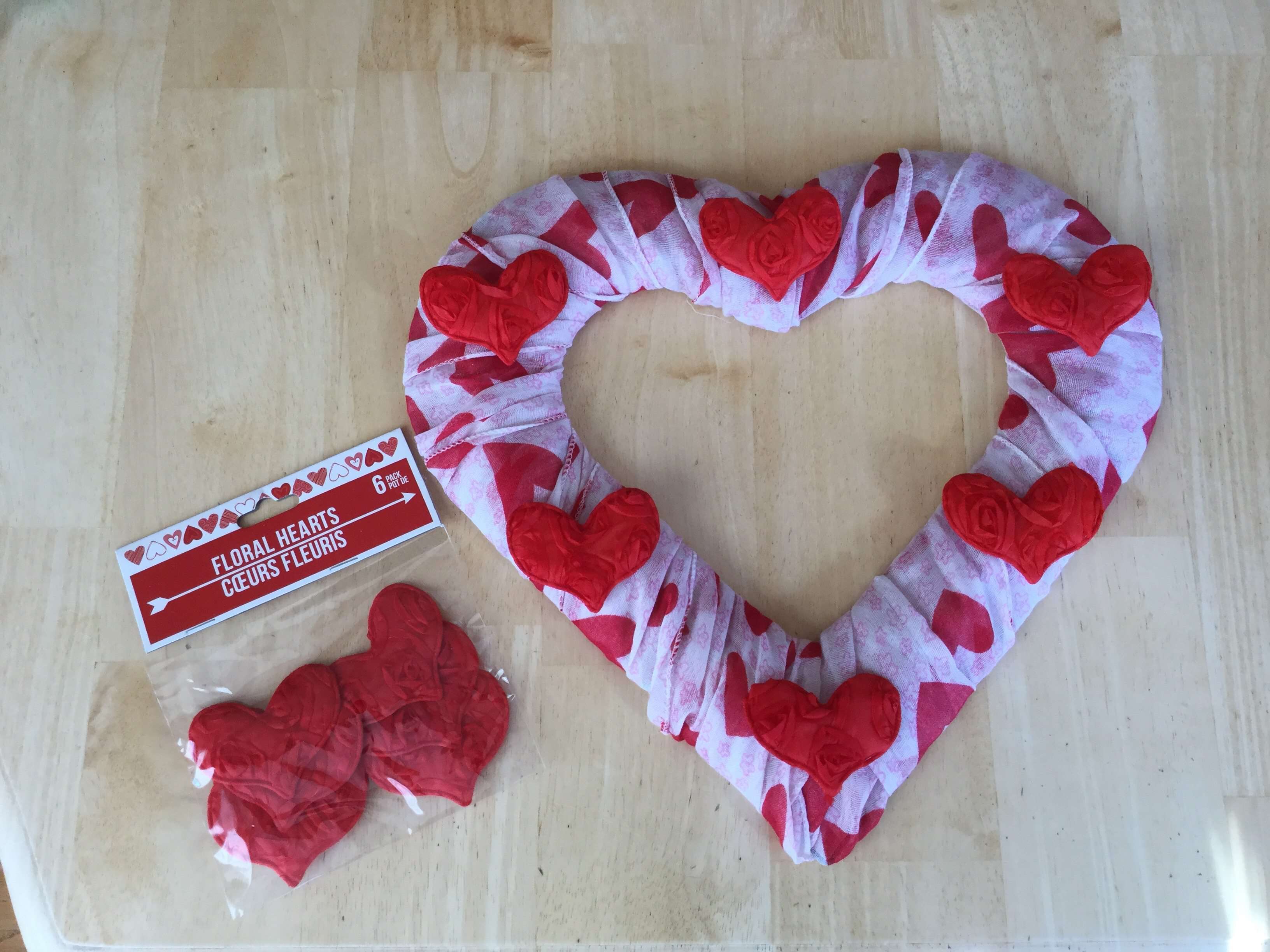Place your fabric heart stickers onto the scarves where desired.