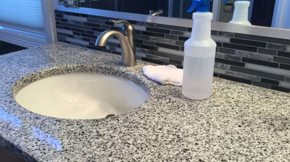 Spray your back splash with the vinegar and wipe it down with a clean wash cloth (it's important that it is clean or you will get streaks).