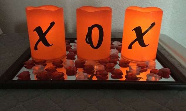 How do you make Valentine's Day decor ideas? This easy LED candle display is inexpensive and easy to make. Just a few candles, a few stickers, a tray with a little table scatter and your set! Great for your home, gift, or craft night party.