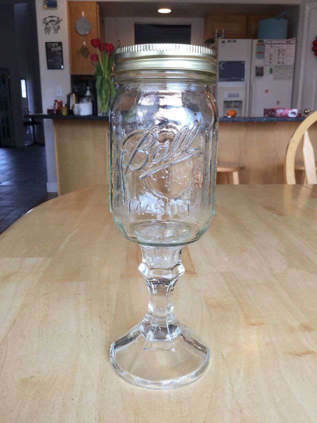 Turn it into a fun drinking glass or use the lid and it’s a fancy container.   Use E6000 to glue a candle holder to the base of a jar. Let dry and you’re done! Fancy it up a bit by adding a handle to the lid.