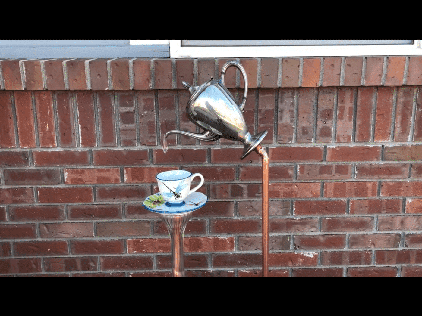 Pouring Teapot & Tea Cup