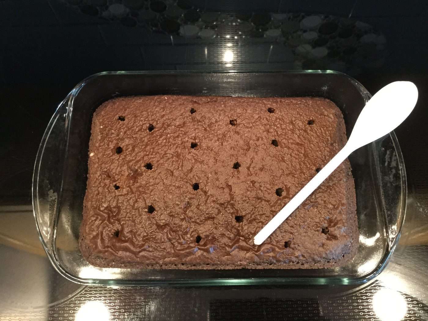 Once completely cooled, poke holes in your cake. (I use the back of a spoon handle)