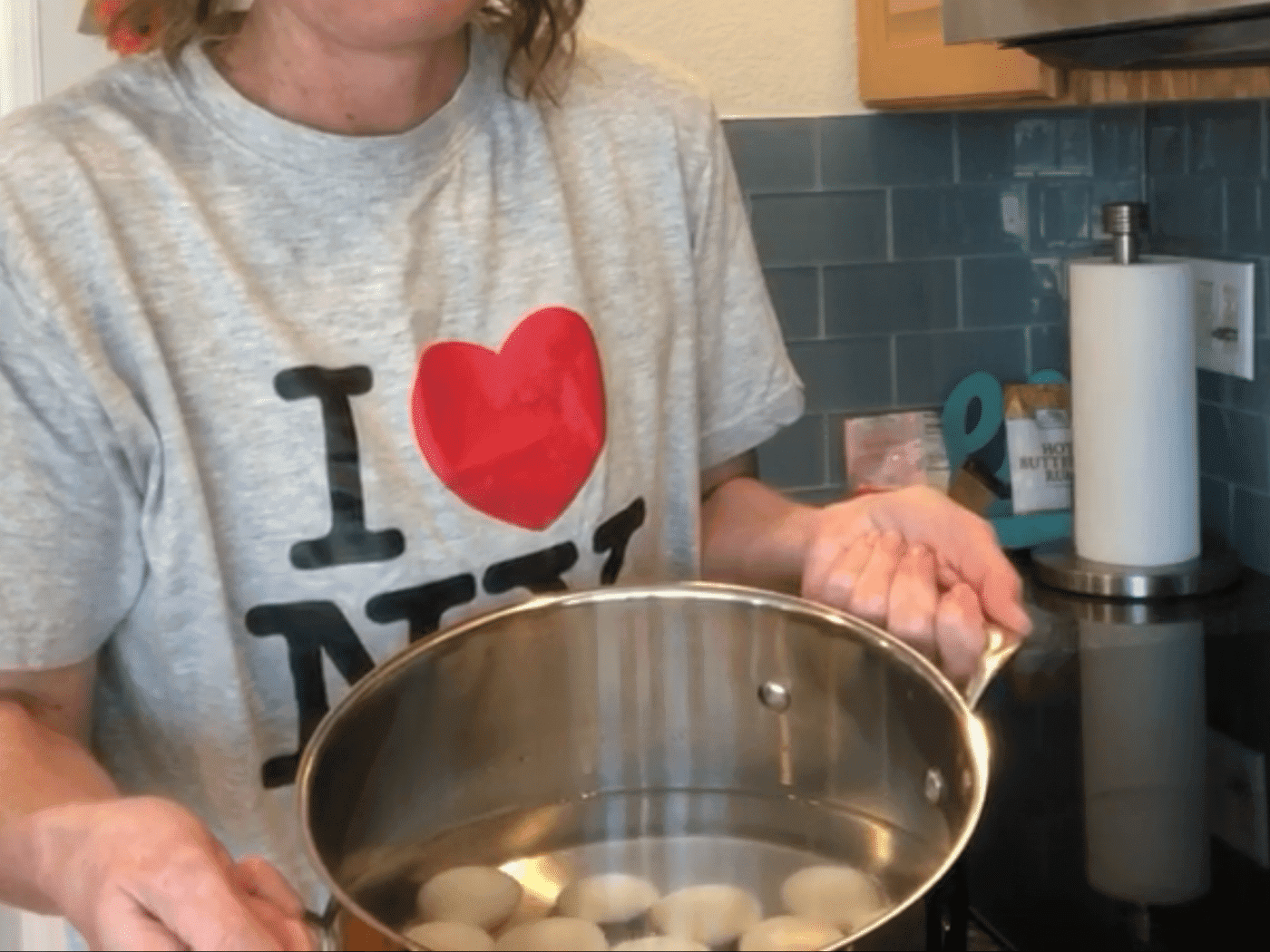 First I place the eggs in a pot of cold water and place it on the stove. Turn the water on and bring to a boil. I also use an Eggtimer - just to make sure my eggs are done.
