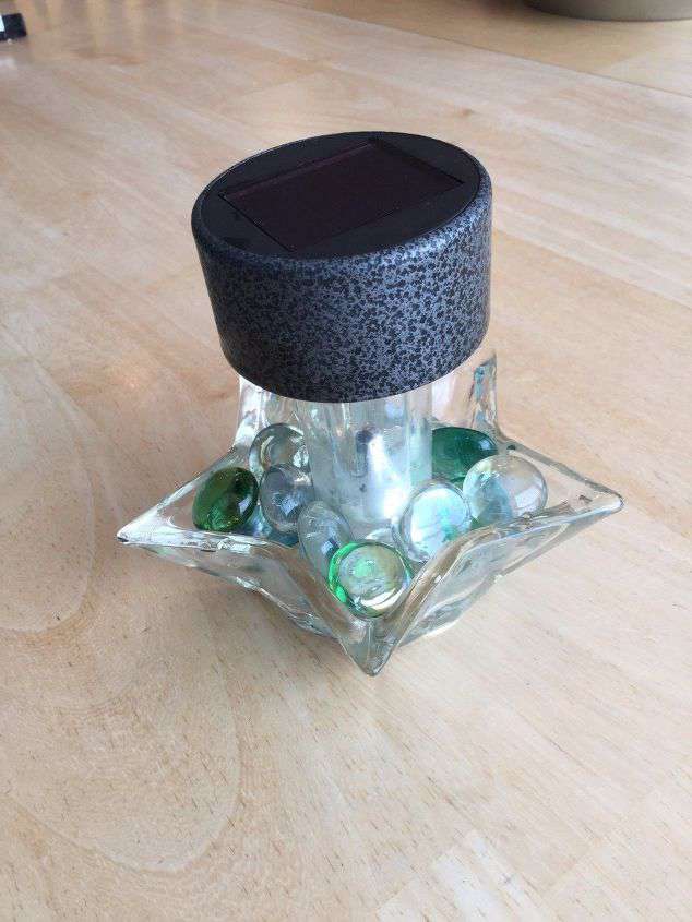 Add your glass rocks to the candle holder base.