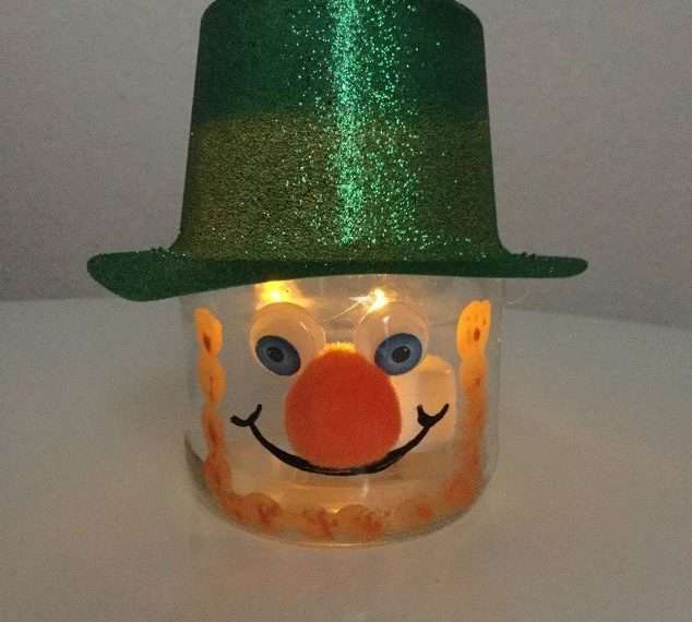 Add a battery operated tea light and make him a candle.