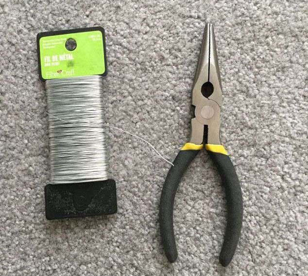 I used some floral/jewelry wire and a wire cutter to attach the utensils to the plant hanger.