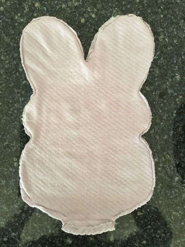 Fold a piece of fabric in 1/2 & put your "right sides" (which means the part that is facing out on your bunny) of fabric together. Draw a peep shape. If you are not comfortable free handing your Peep, google search a picture of a peep, cut and paste it onto a piece of paper, make it the size you want, and print it for a pattern. Cut your double layer of fabric, and stitch or hot glue the bunny together. Make sure to leave an opening at the bottom for stuffing.