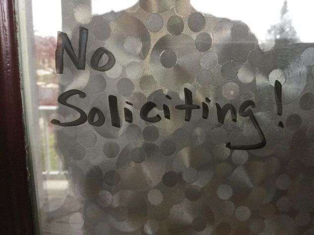 Another option would be to use a dry erase marker on your windows by your door or porch door and write the words "No Soliciting." Dry erase comes off very easy if you want to clean windows, or change it up.