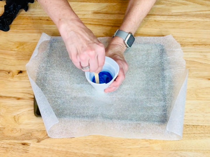 Mixing school glue and food coloring together