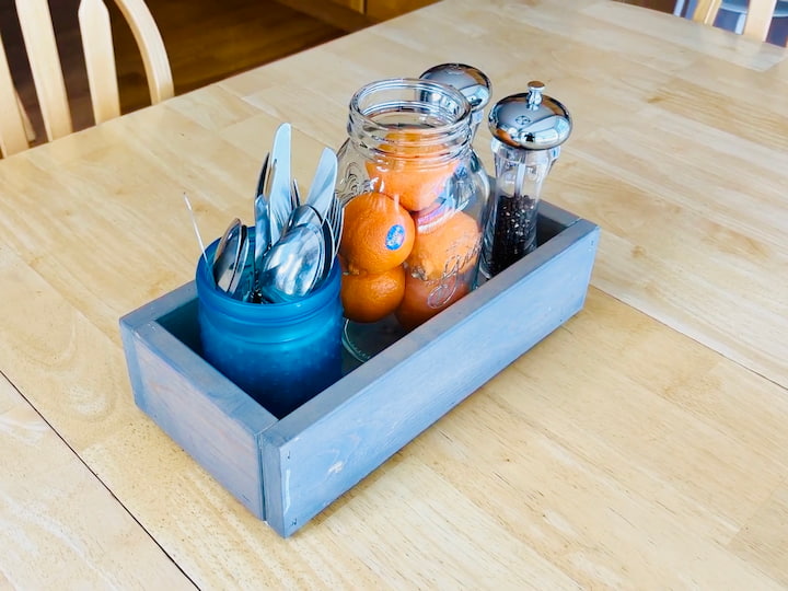 Using the glass jar to hold silverware on table