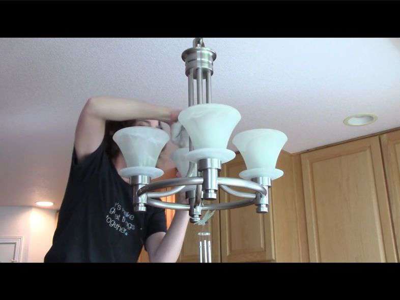Using a bucket of soapy water, I wiped down my light fixture. Mine is hard to come apart so I do the best I can wiping them down. Otherwise I recommend removing the light bulb and glass, washing the glass and replacing all when dry. I also wipe down all of the outlets and light switch plates. They tend to collect fingerprints as well as the grease cooking particles over time. You could remove these, wash them in your sink, and then replace them as well if you like.