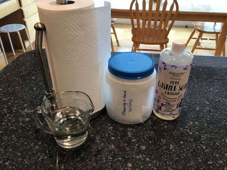Mix 1 Tablespoon Castile soap and 1 cup water together. Cut a roll of paper towels in half and place in a container of your choice. Pour the water soap mixture over the paper towels. After a couple minutes, pull out the paper towel tube in the middle. It'll come right out. Pull the paper towels out of the middle.