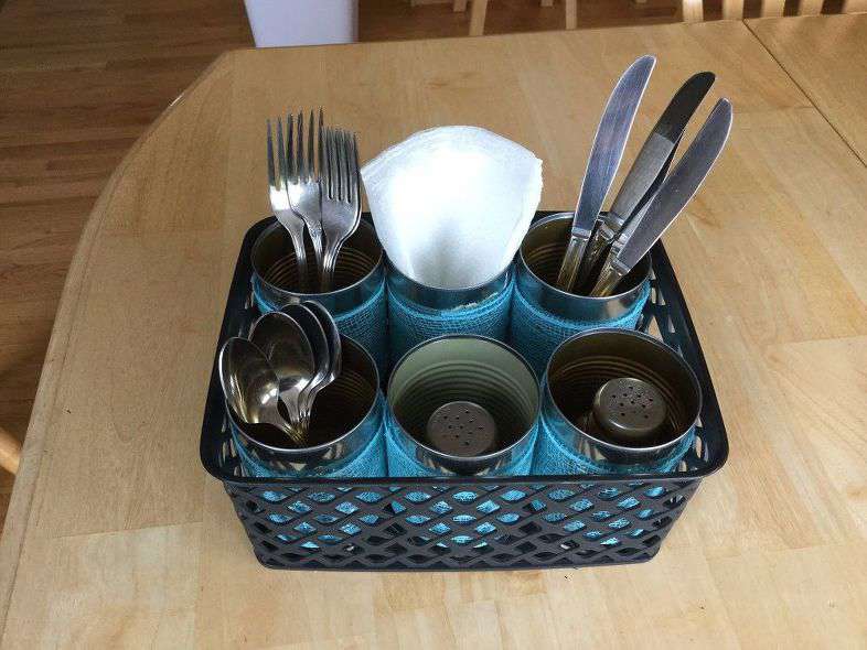 Fill the cans with silverware, napkins, salt and pepper shakers. Now you can bring this caddy inside or out with easy. This basket had more room, so I could have set the napkins & salt and pepper shakers in the middle between the cans and used those cans to hold other supplies needed.