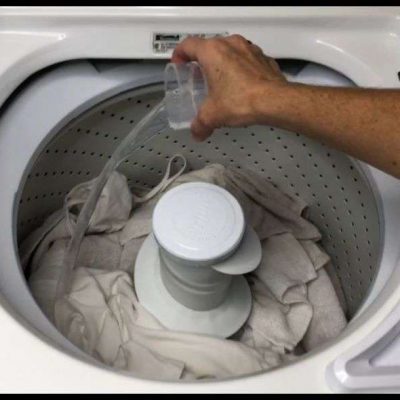 adding diy laundry hack cleaner to washing machine