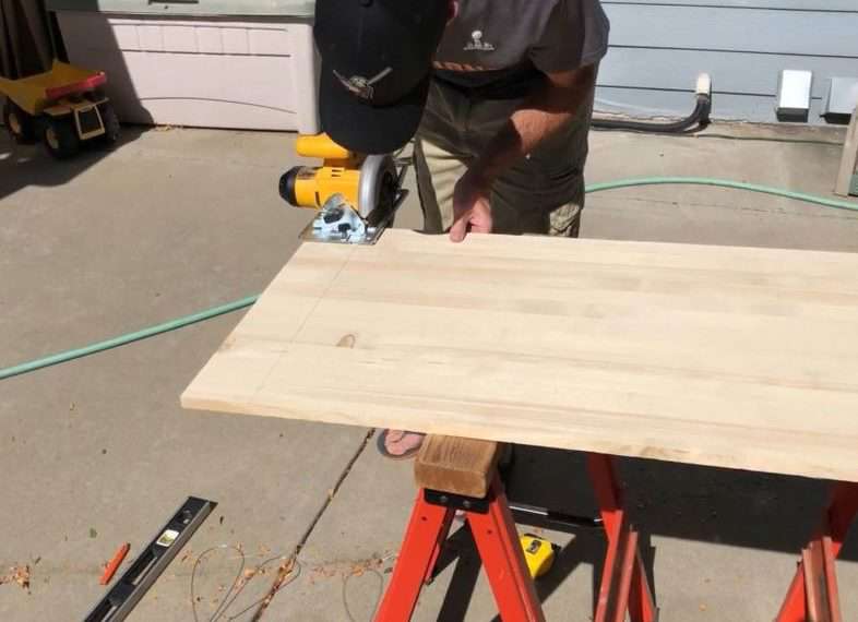 We used a Craft Master's Spruce board that we bought at our local hardware store. He measured and marked where to cut the shelf and then cut it.