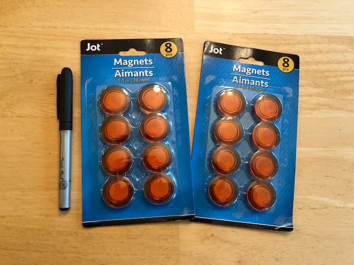 For this project, I grabbed some orange magents from the office section at the dollar store. I drew a variety of pumpkin faces on the magnets. This made a great party favor for me to hand out. It also makes a great kids' project as well.