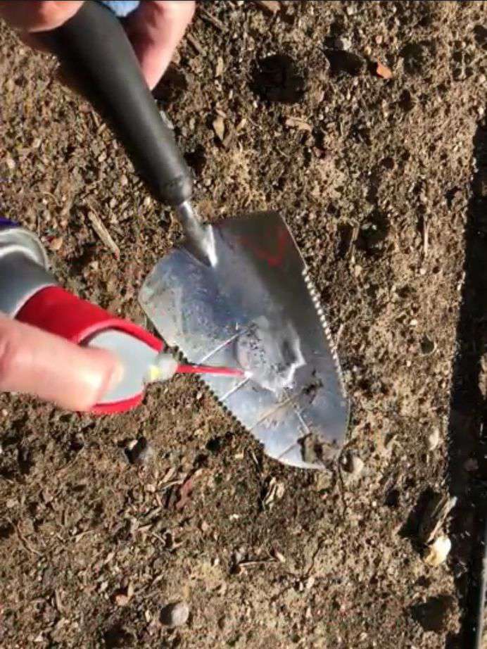 Spray a little on your shovel, it'll not only clean your shovel but it'll keep the dirt from clumping onto your shovel as you continue your work.