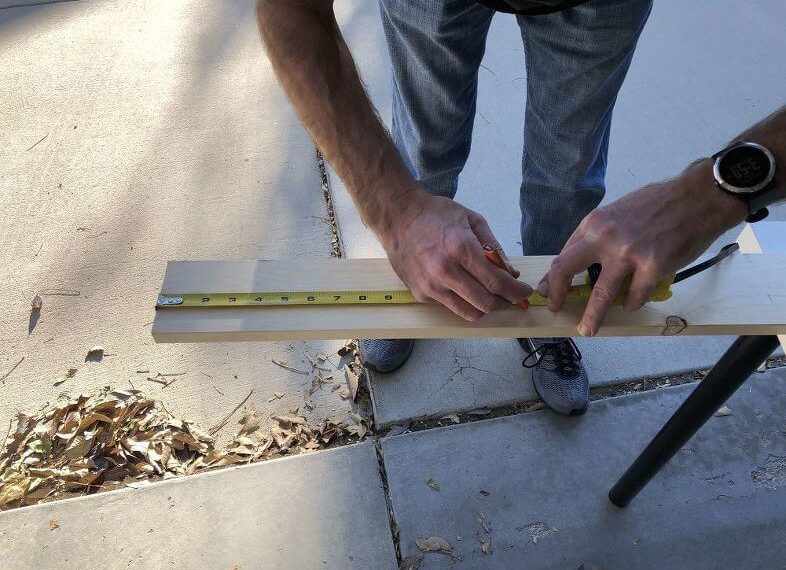 For the sides of this board we used a 1 x 4 pine board and measured it to 14 inches.