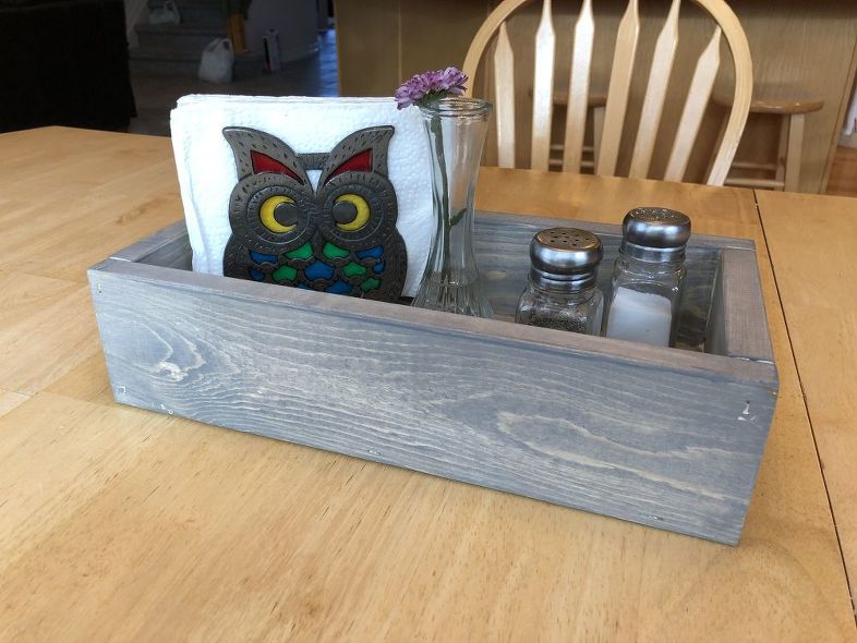 Here is where I'm using ours - on our kitchen table.  I love that it keeps our salt and pepper shakers, and napkins in there and I can pick it up to easily wipe up the table.