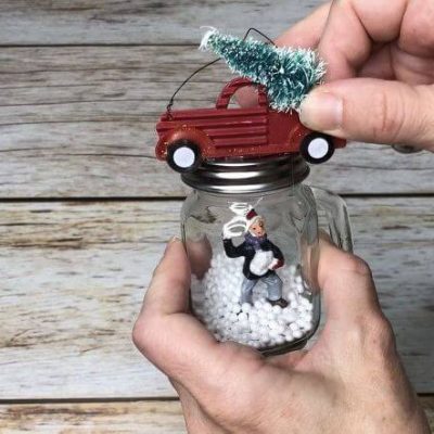 I added a small ornament of the famous red truck hauling a tree to the top of the ornament.
