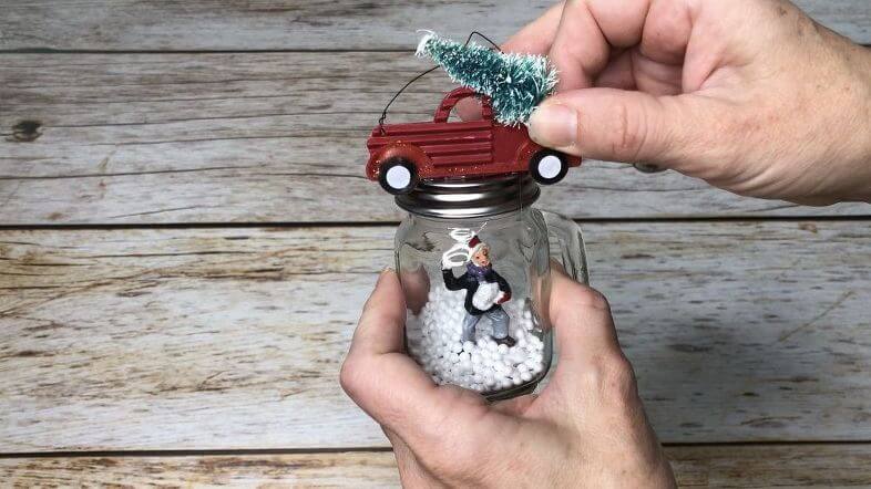 I added a small ornament of the famous red truck hauling a tree to the top of the ornament.