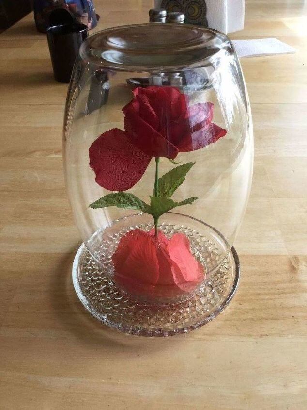 You'll take your vase and place it over the rose and onto the candle holder dish.