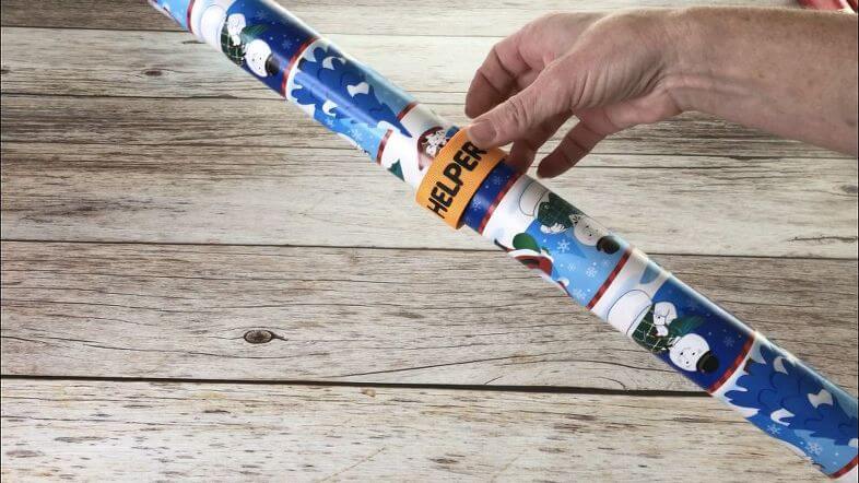 I use "slap bracelets" to hold my wrapping paper together so it doesn't unravel or get torn.