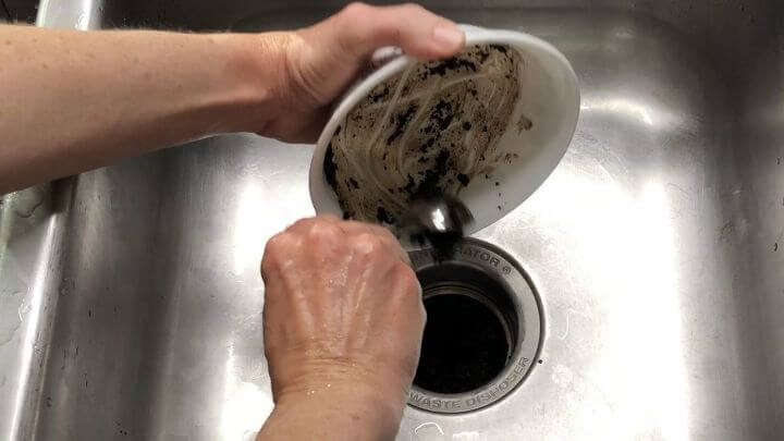 Pour your coffee grounds into your garbage disposal. Run the disposal and it will clean and deodorize it.