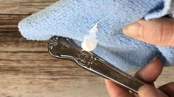 Place some regular toothpaste on a microfiber cloth and buff tarnish off silver.