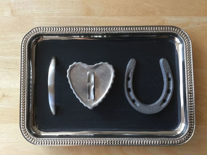 I next hot glued on the heart cookie cutter, and then the horse shoe so that the sign would say "I love you".