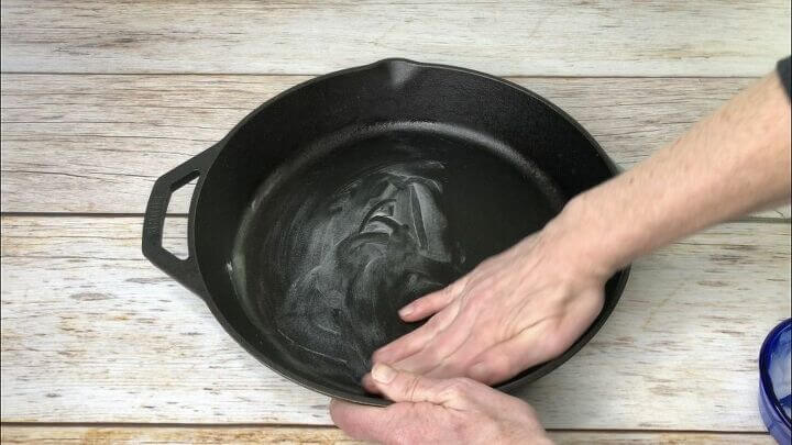 Spread coconut oil all over the inside of a cast iron pan. 