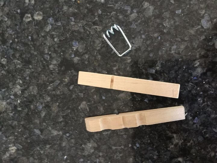 Pull apart your clothespins. This is to prevent your metal from rusting in the vinegar water.