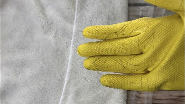 The hair will stick to the hairspray on the glove. Rinse your glove off and repeat the process.