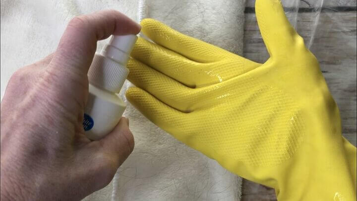 Spray hairspray onto a rubber glove.