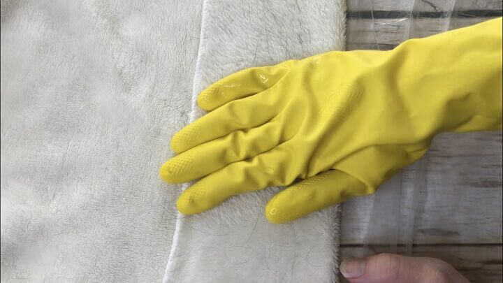 Wipe the fabric with the pet hair with your glove.