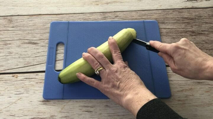 Place a rubber band on either end of your cutting board and it'll help hold the cutting board still while you're working on it.