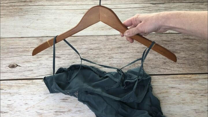 Put rubber bands on either end of a hanger, then put your clothing onto the hanger.
