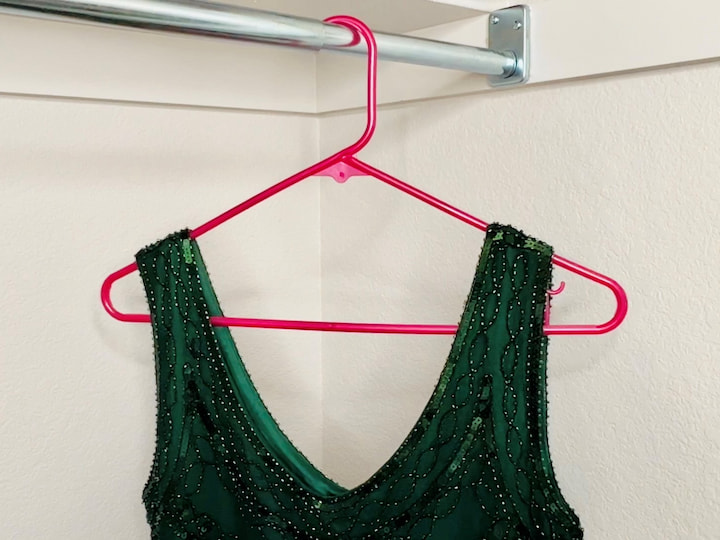 This next hack works with any hanger. Just grab some rubber bands and put them on either end of your hanger. This will keep your shirts and tank tops from sliding off. If you are hanging your pants on a hanger you can end up with a crease, but I have a solution.