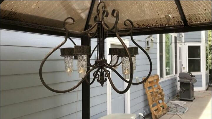 This solar chandelier is a candle holder that was missing the glass pieces to hold the candles. The solar lights fit right into the holes. It creates some great ambiance in our gazebo.